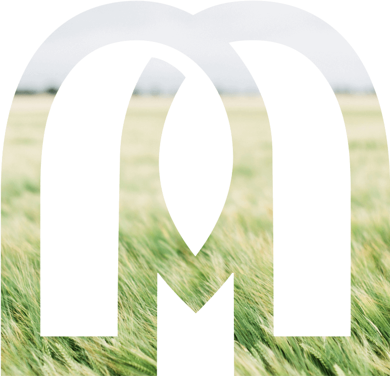 Mitus emblem filled with a sunlit field